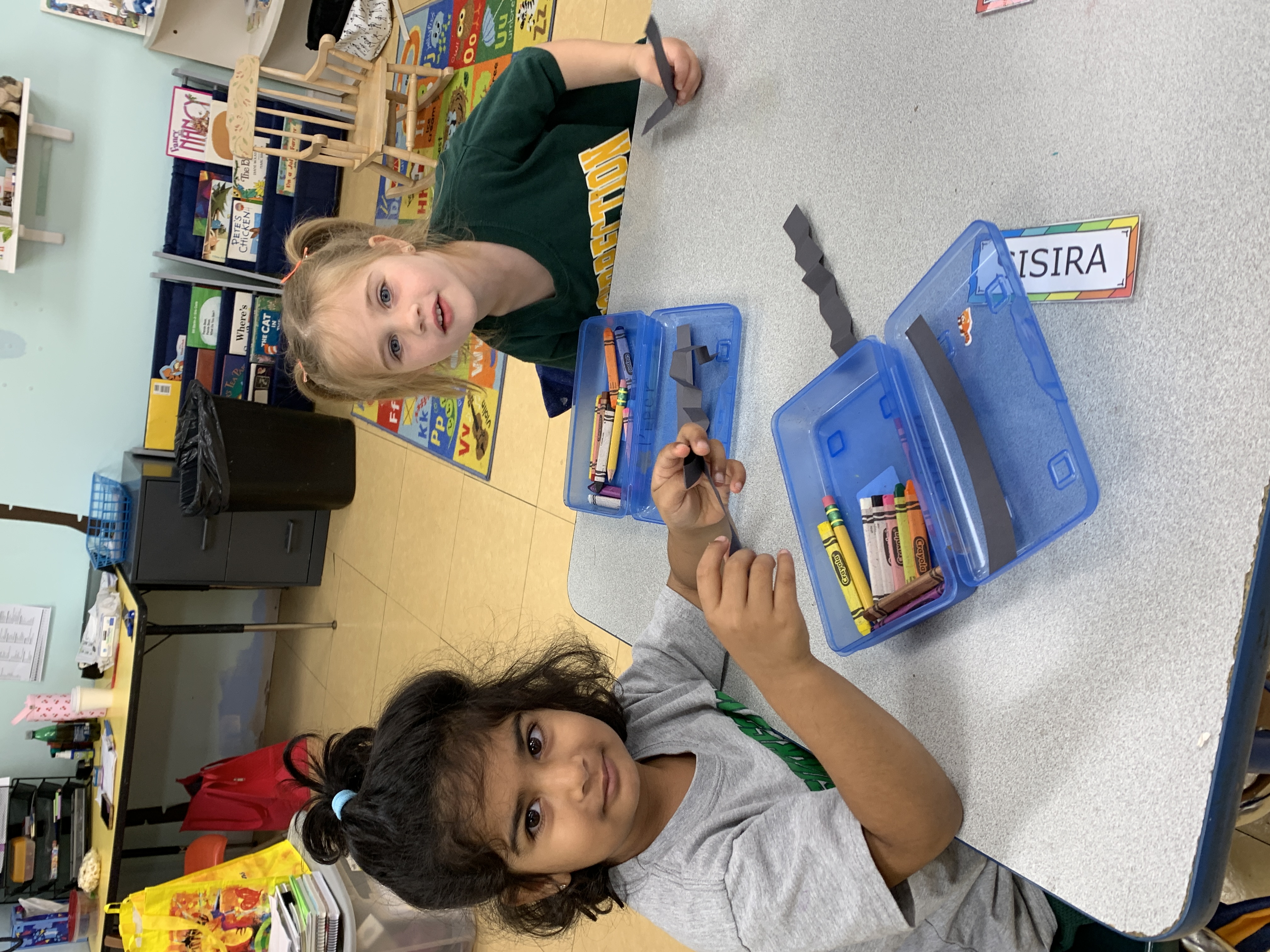 Preschool students exploring centers